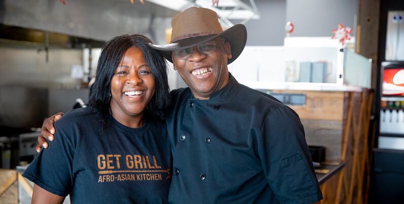 Get Grill brand owners in their restaurant